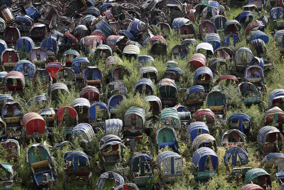 Wrecked rickshaws are seen in a dump yard at Mirpur in Dhaka