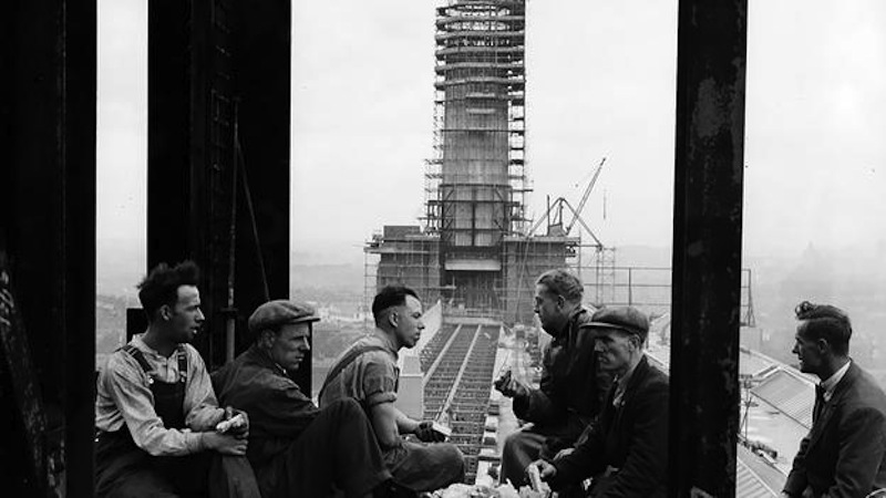 Builders of the 300 ft tall chimney stacks take a break and admire the view