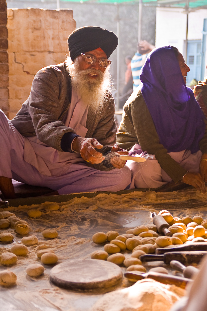 Tossing the bread on down the assembly line, Gurdwara Bangla Sah