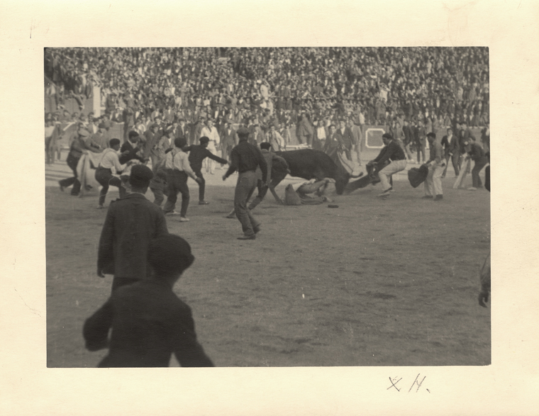 EH 7891P Ernest Hemingway fighting a bull in "The Amateurs", Pamplona, Spain 1925. ("X H." on border below image). Photograph in the Ernest Hemingway Photograph Collection, John F. Kennedy Presidential Library and Museum, Boston.