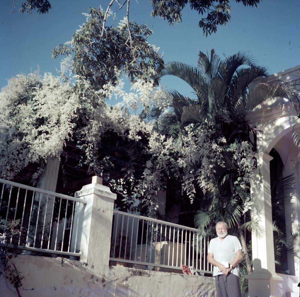 EH-C217T 1950s? Ernest Hemingway outside of his home, Finca Vigia, San Francisco de Paula, Cuba.