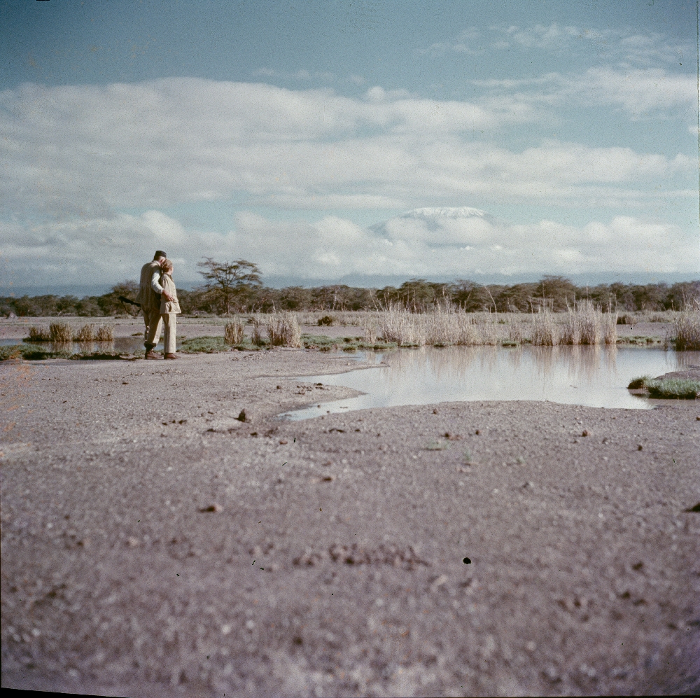 EH-C541T ca. 1953 Ernest Hemingway and Mary Hemingway arm in arm, hunting. Africa. Copyright unknown in the Ernest Hemingway Collection at the John F. Kennedy Presidential Library and Museum, Boston.