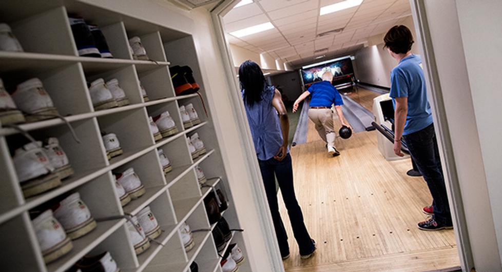 Once shoes are on, guests are free to enter the two-lane facility, pick out a ball from the racks and begin scoring. (M. Scott Mahaskey/POLITICO)