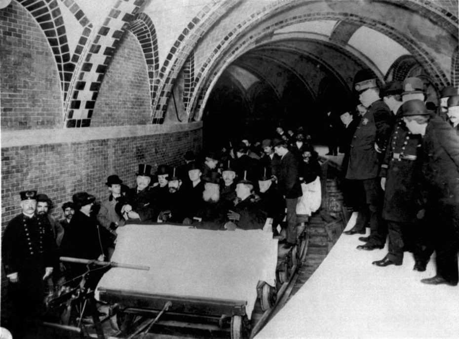 This group of financiers and city officials get a tour of New York City's first subway in January 1904 while the city's policemen stood by on the platform at City Hall Station. Seated toward the front of the ceremonial flat car are Alexander Orr, August Belmont, John B. McDonald, and Mayor George B. McClellen. (AP Photo/NYC Transit Authority)