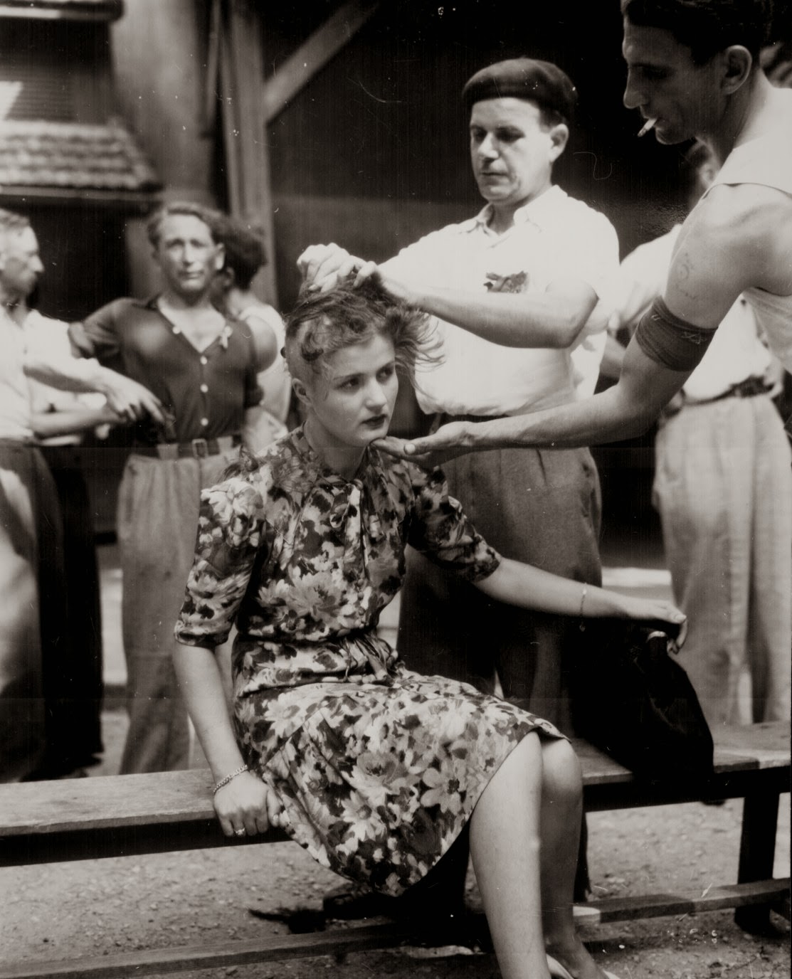 a-french-woman-has-her-head-shaved-by-civilians-as-a-penalty-for-having-consorted-with-german-troops-1944