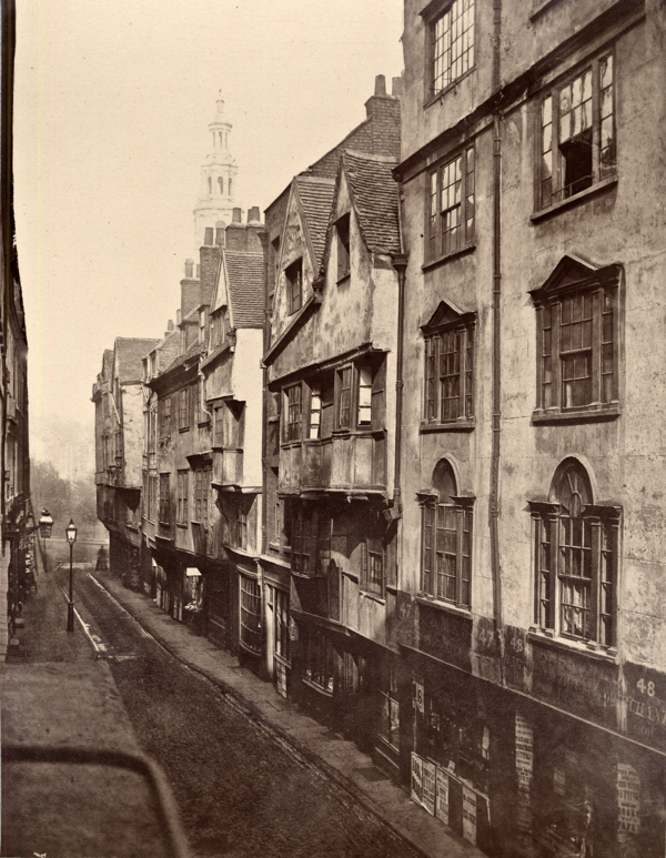 Woman turning the corner onto Wych St