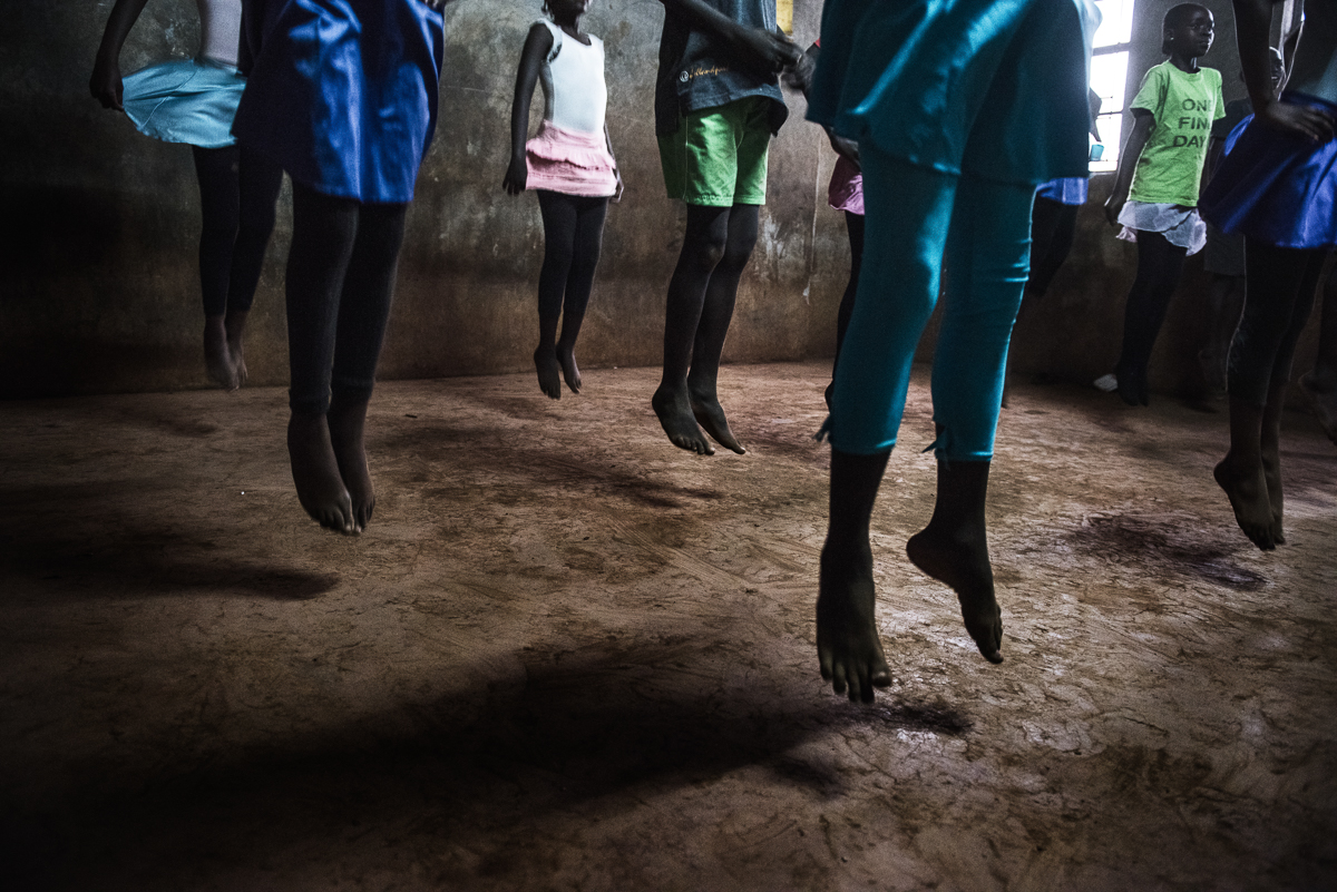 The mix of classical music, Mike's voice going" One, Two, Three Four!" and the colourful dresses turns the grey cold room into a real ballet studio