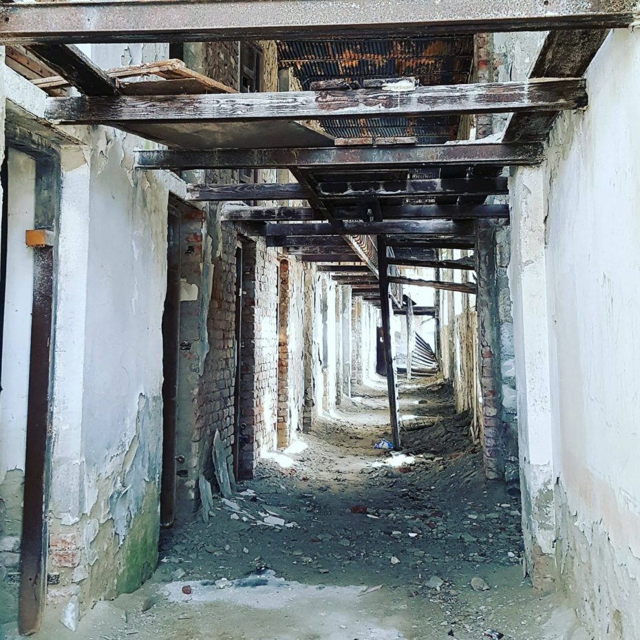 abandoned corridor in doftana prison romania