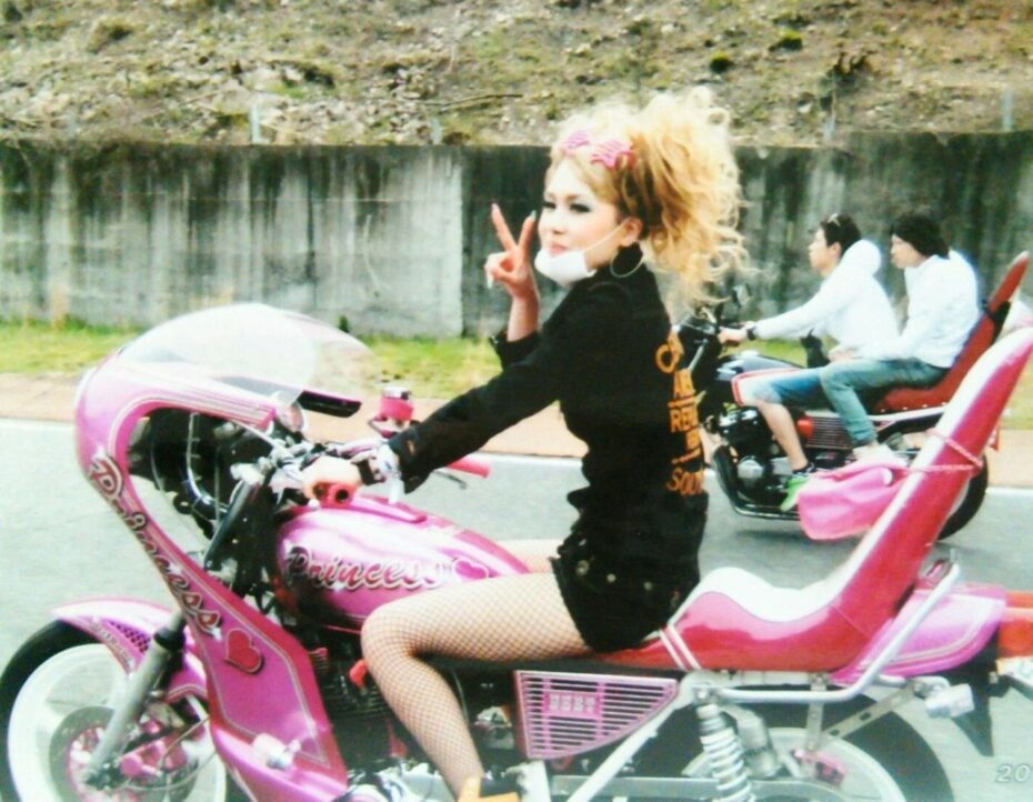 Girl motorcyclist with wavy black short hair on Craiyon